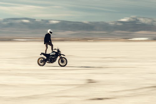 A Rider Standing on The Motorcycle