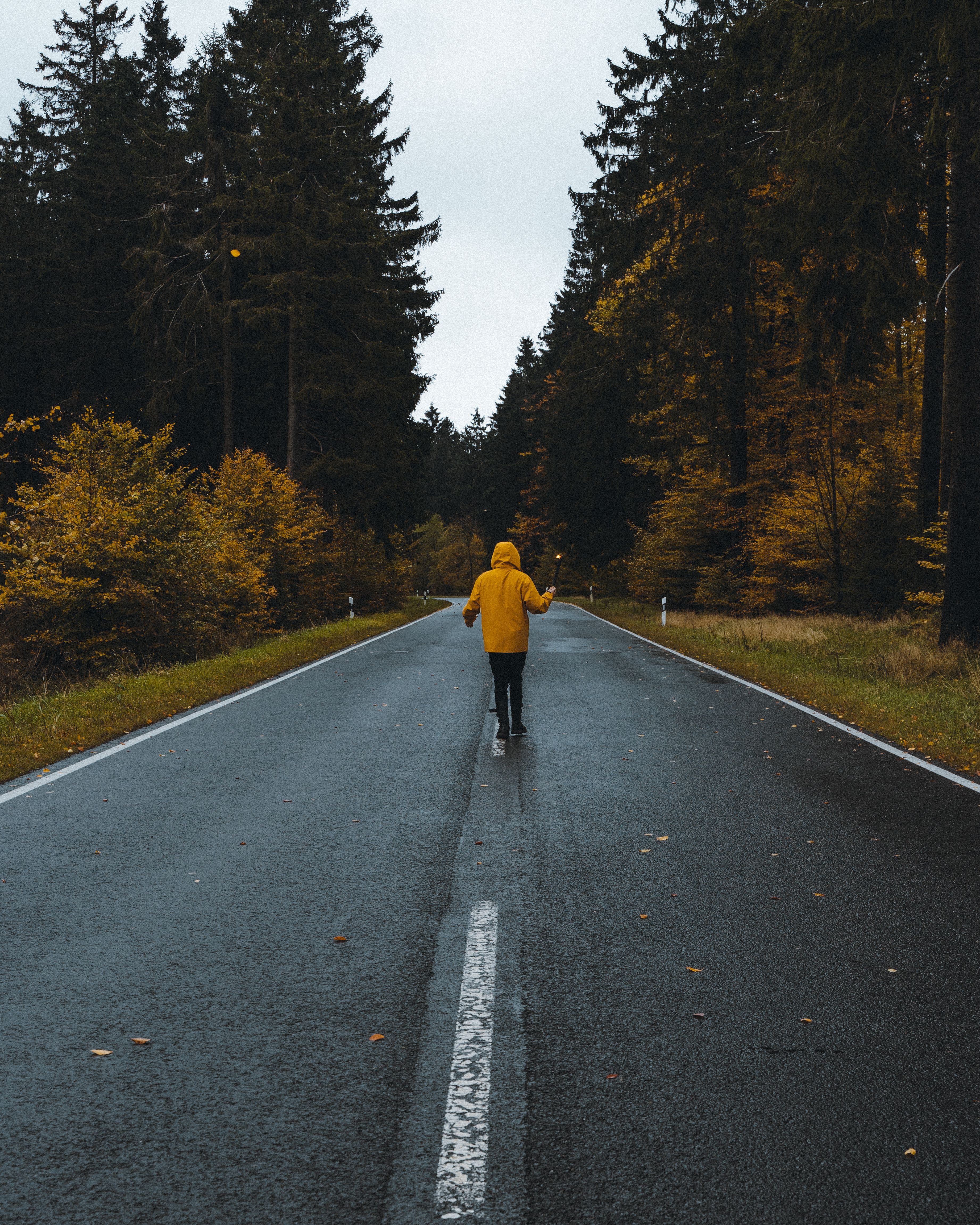A Man in Yellow Jacket Standing on the Road · Free Stock Photo