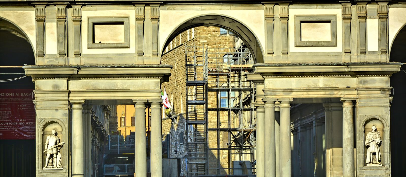 The elegant entrance of the Uffizi Gallery in Florence, showcasing classical architecture.