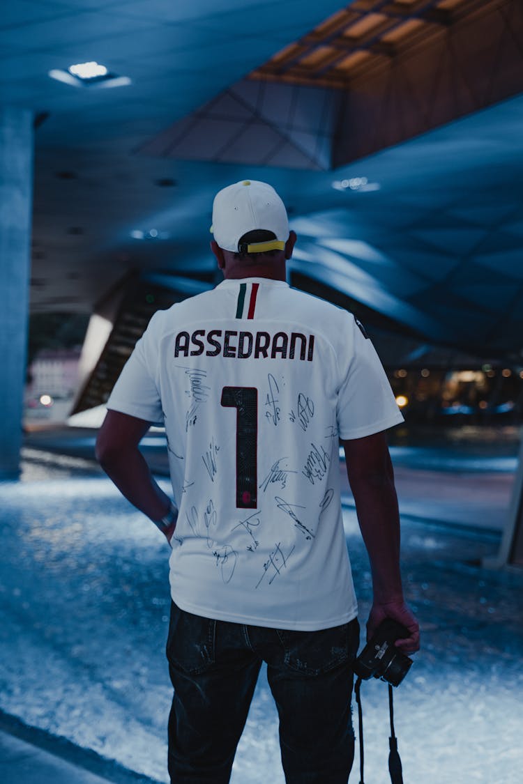 Back View Of A Man In A Jersey With Signatures