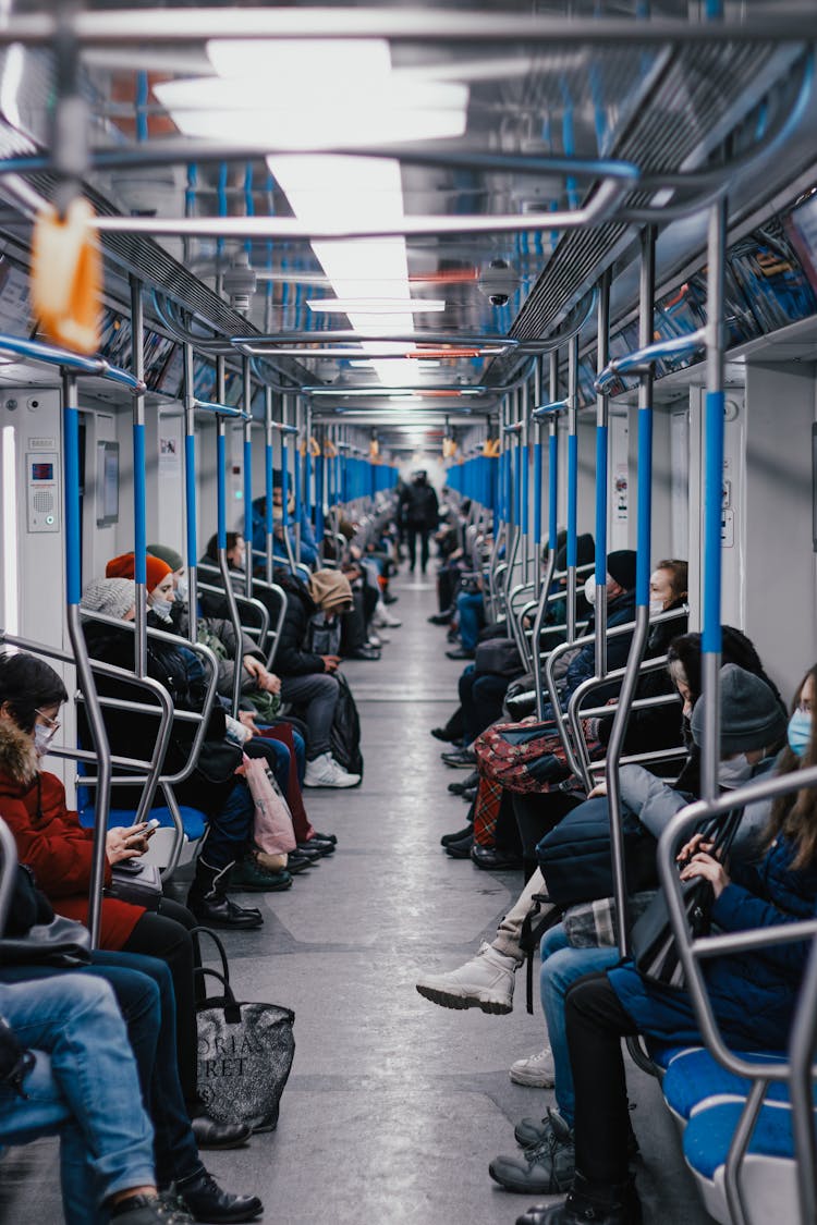 People Sitting In Subway Train