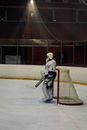 Man in White and Red Ice Hockey Jersey Playing Hockey