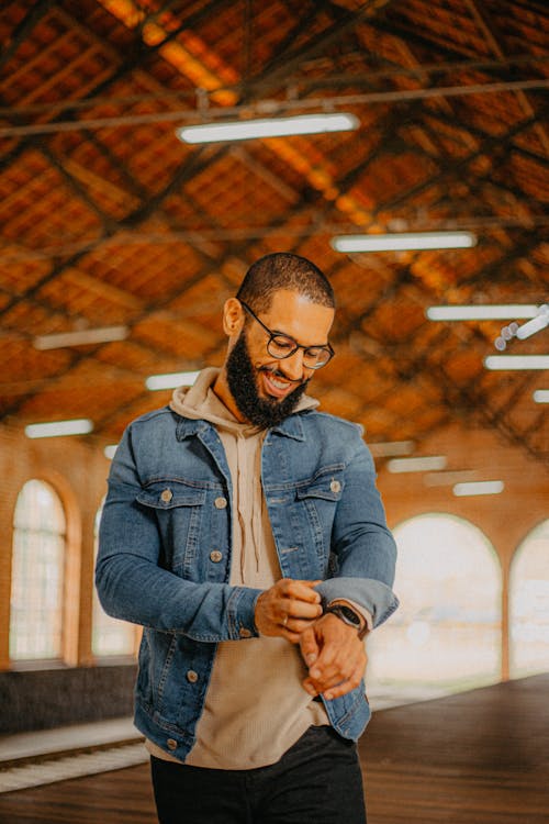 Free A Man in a Denim Jacket Smiling Stock Photo