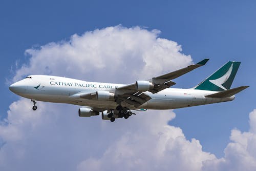 Close-up Photo of a Flying Cathay Pacific Airplane 