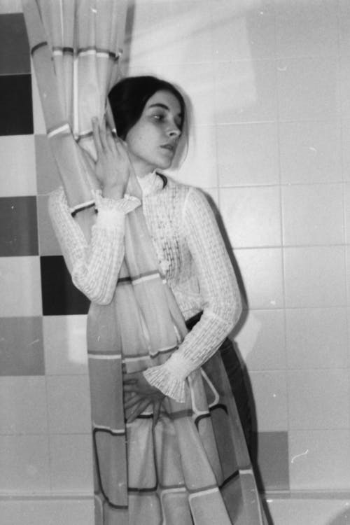 A Woman Hugging a Shower Curtain