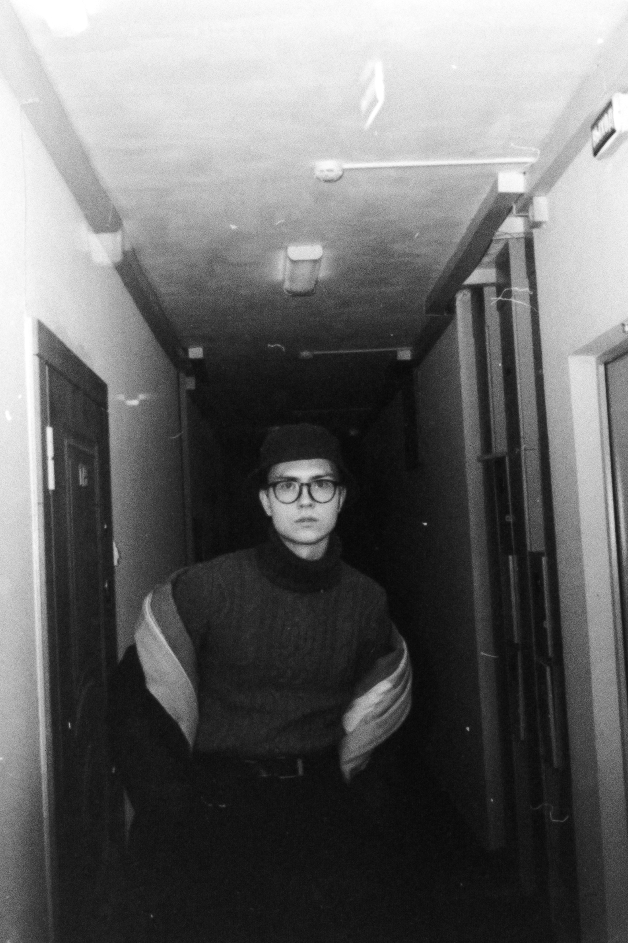 a man wearing eyeglasses and hat