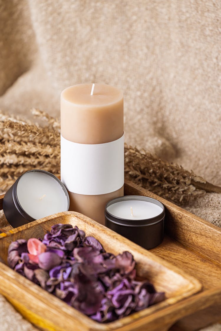 White Pillar Candle On Brown Wooden Tray