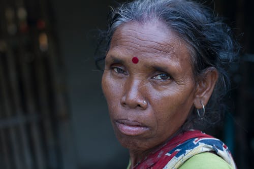 An Elderly Woman with Bindi Mark