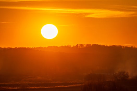 Stunning golden sunset casting warm hues over a peaceful landscape, capturing the essence of nature's beauty.