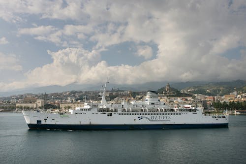 White Cruise Ship on the Sea under the Cloudy Sky