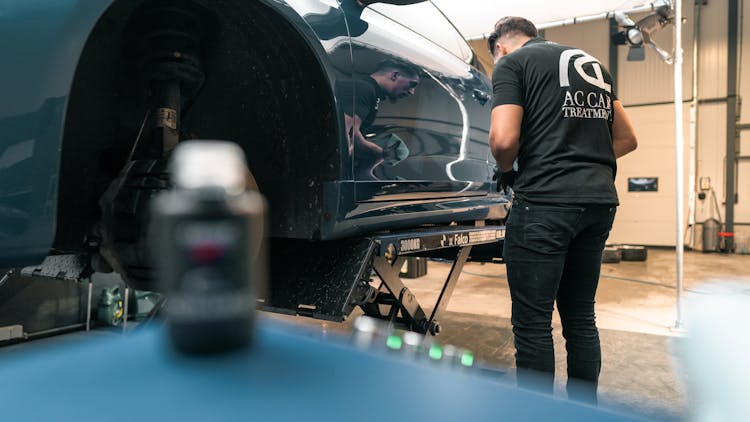 A Man Repairing A Car 