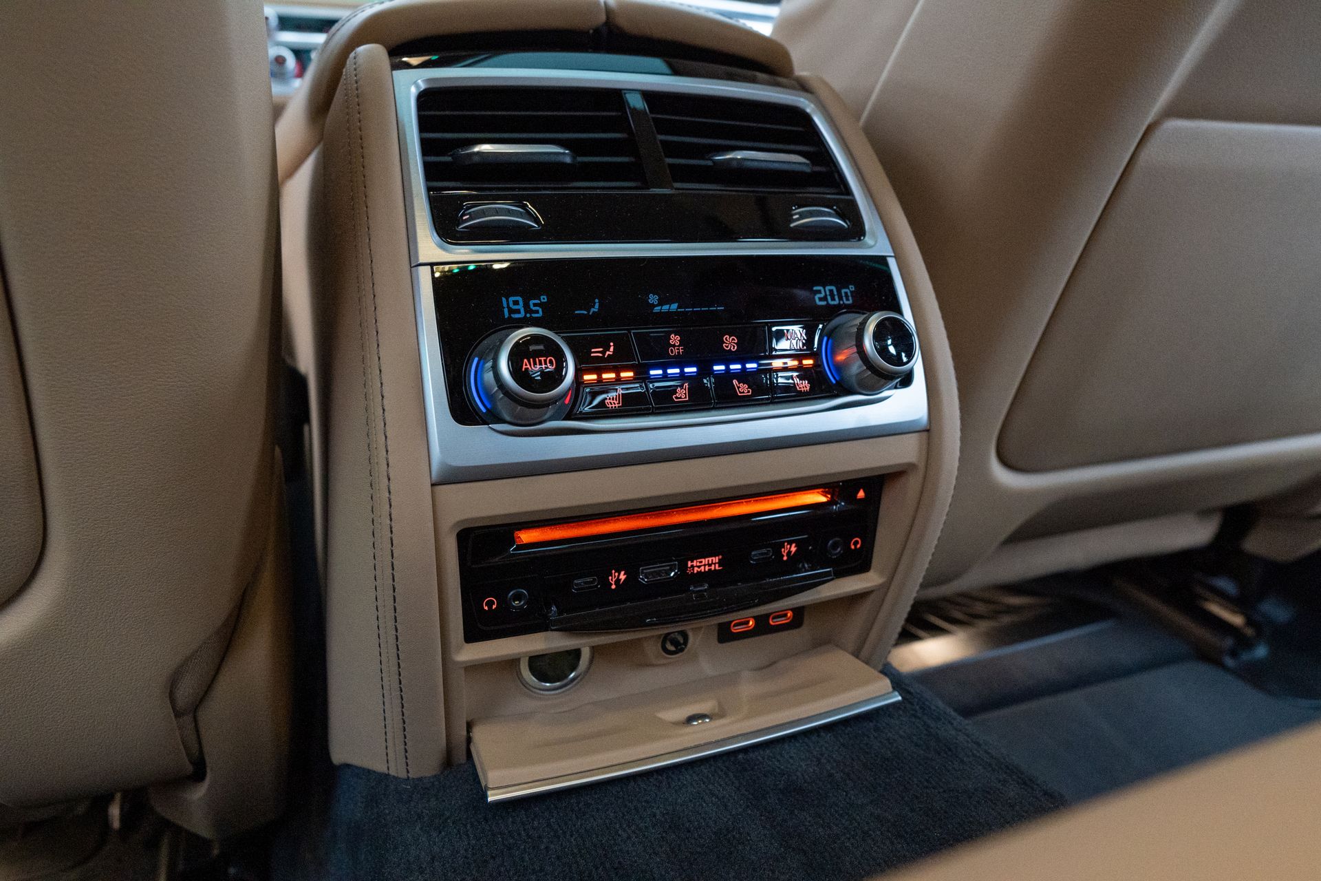 High-end car interior showcasing advanced climate control and digital interfaces.