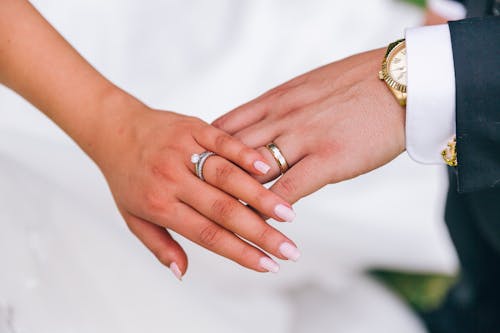 Free A Couple Wearing Their Wedding Bands Stock Photo