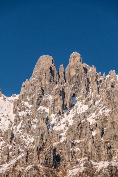 Free A Rocky Mountain Under Blue Sky Stock Photo