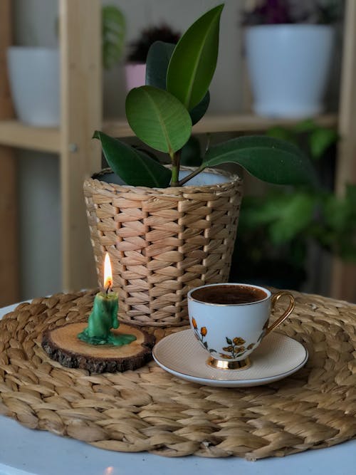Free Photo of a Cup Near a Lit Candle Stock Photo