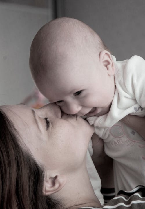 Mother Kissing Her Baby