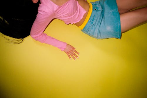 Free Woman in Pink Long Sleeve Shirt and Blue Denim Skirt Stock Photo