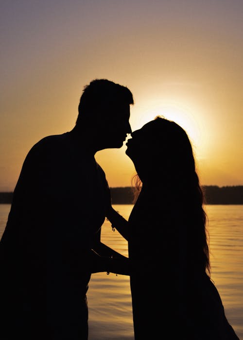 Silhouettes of a Couple Kissing