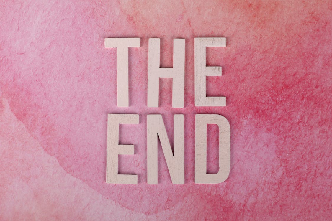 The phrase "The End" against a pink background.