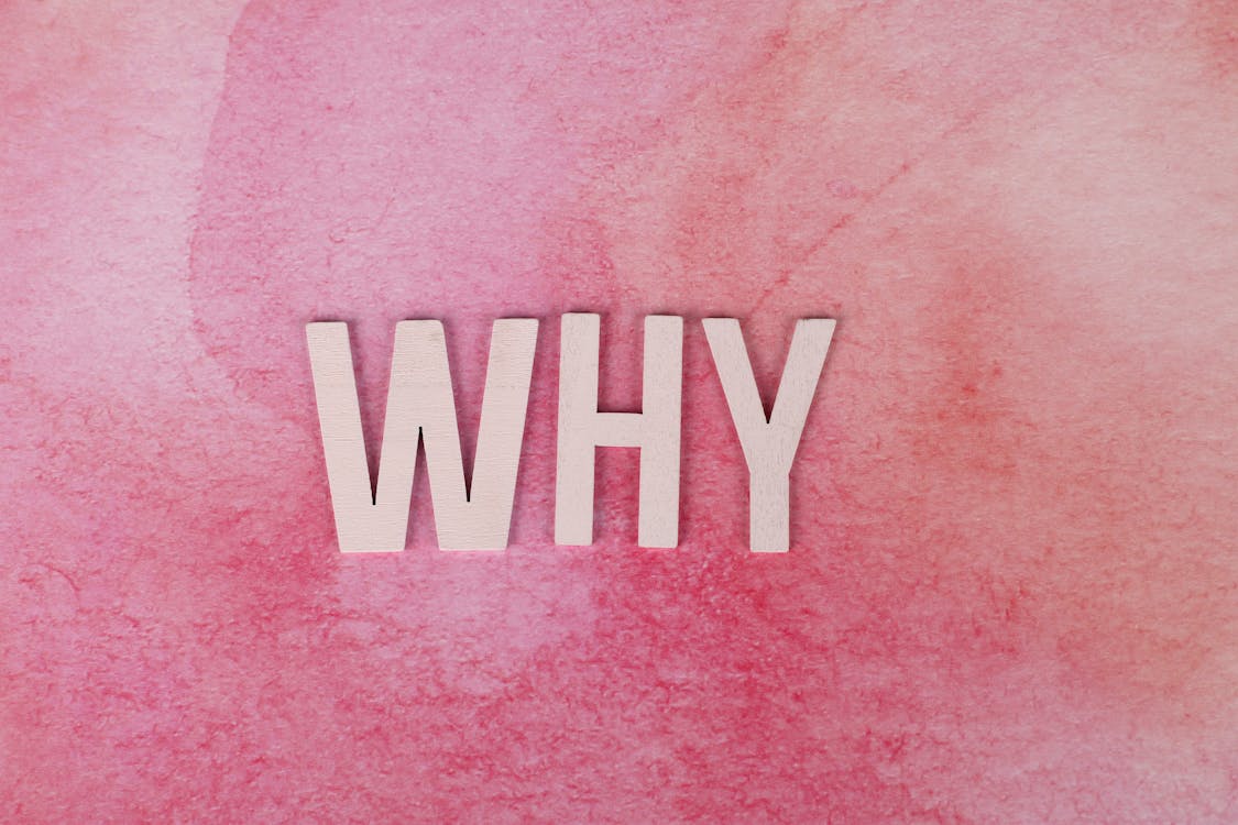 Free Why Text on a Pink Surface Stock Photo