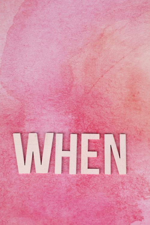 Free The word 'WHEN' displayed on a textured pink background, offering inspirational copyspace. Stock Photo