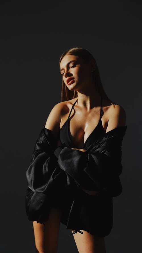 Young Woman Posing in Black Bikini and Black Jacket 