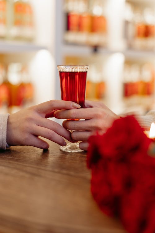 Unrecognizable Female Hand Touching Male Hand Holding Wine