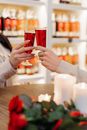 Two Unrecognizable Hands Making Cheers with Wine