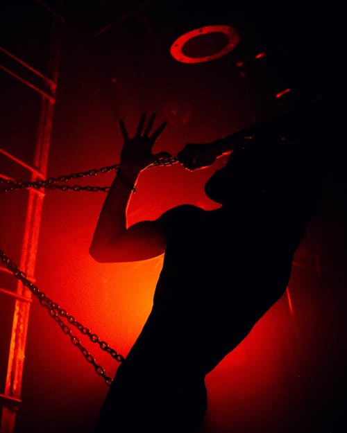 Silhouette of Person in Chains