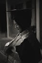 Grayscale Photo of a Woman Wearing a Mortarboard Hat