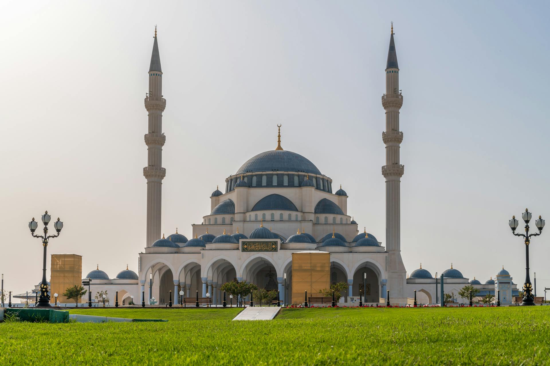 Stunning view of a grand mosque with traditional Islamic architecture in Sharjah.