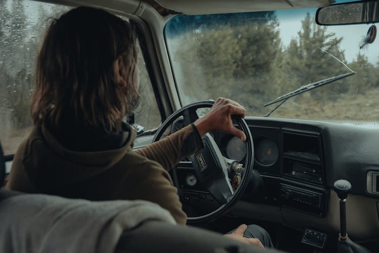 Back View Of A Person Driving A Car