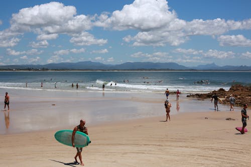 Free Tourists Enjoying Summer Vacation on a Beach Resort Stock Photo