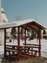 Brown Wooden Gazebo Covered With Snow