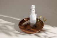 White Pillar Candle on Brown Wooden Round Tray