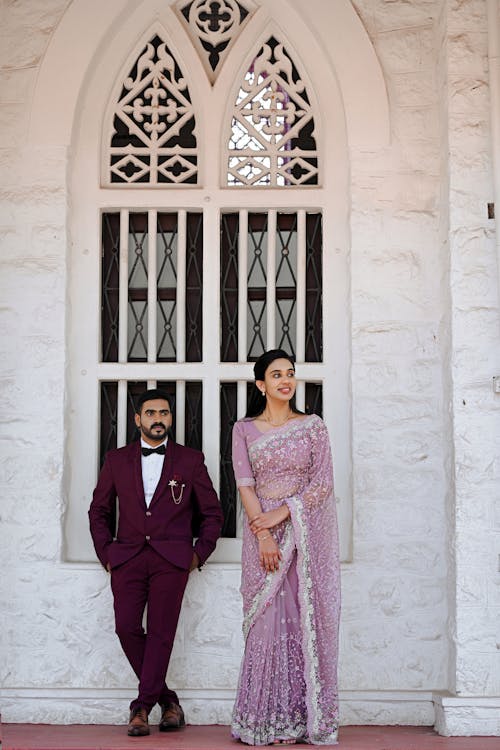 Adult Man and Woman Standing in Kerala Wedding Outfits