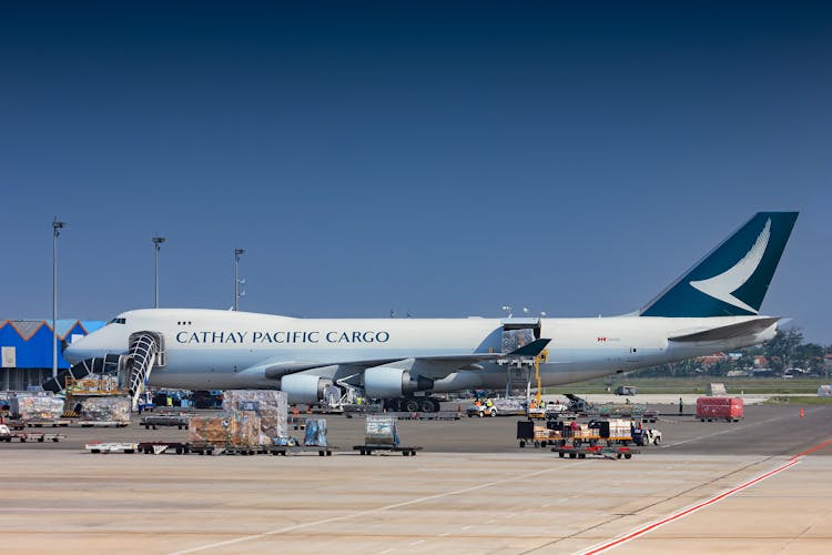 A White And Blue Airplane On Airport