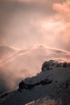 Breathtaking view of snow-covered mountains in Turkey during winter at dawn.