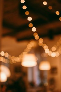 A beautiful display of warm bokeh lights creating a cozy and inviting atmosphere indoors.