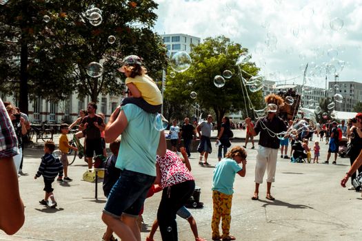 Photo of People Playing with Bubbles