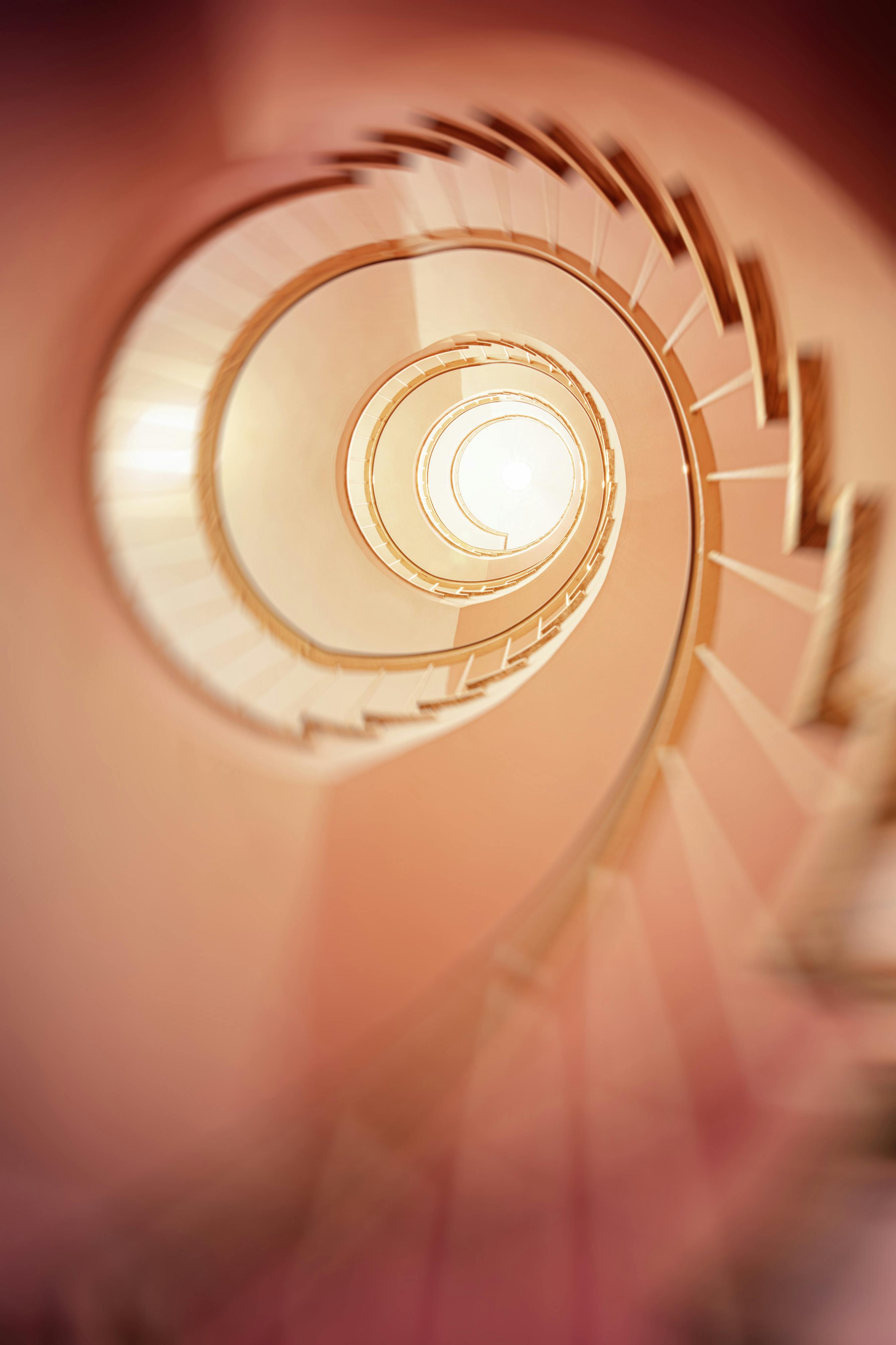 low angle photography of spiral stair