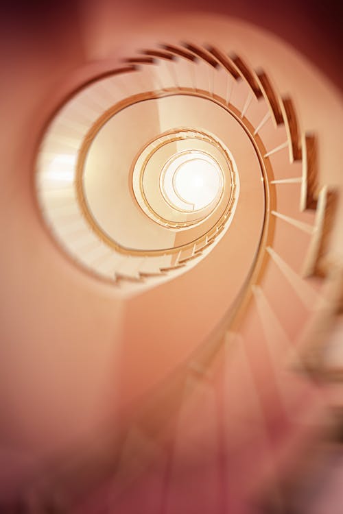 Low Angle Photography of Spiral Stair
