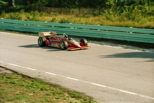 Free A vibrant race car speeding on a sunny day at Elkhart Lake, Wisconsin. Stock Photo