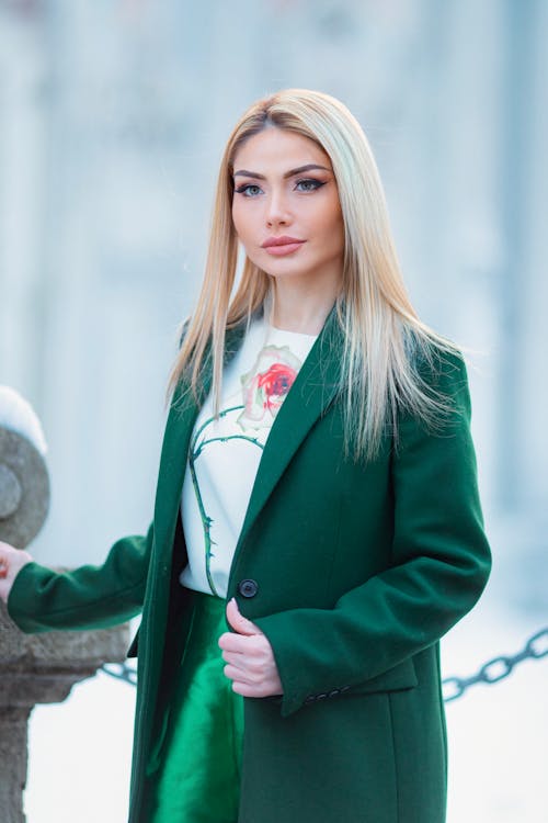 Attractive Blond Woman in Green Coat