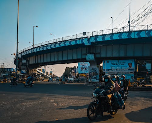 People Riding Motorcycle in the City 