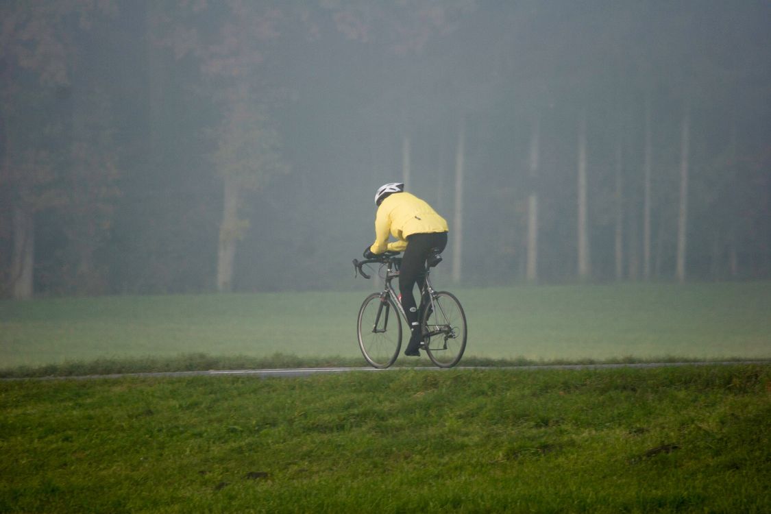 Image Cycle Photo of a Person Riding a Bicycle Near Grass · Free Stock Photo