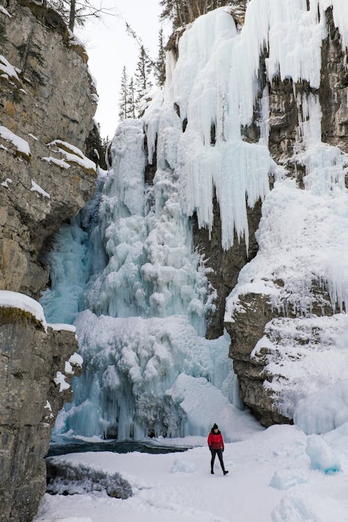 Woman Under a Frozen Waterfall 