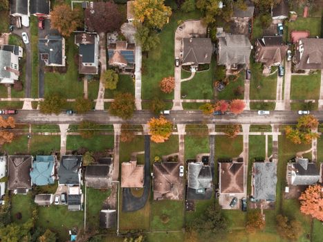 Aerial view of a suburban neighborhood in Ohio showcasing fall foliage and residential houses.