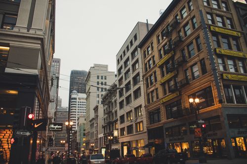 Free Dynamic urban scene showcasing modern and classic architecture with bustling city streets. Stock Photo