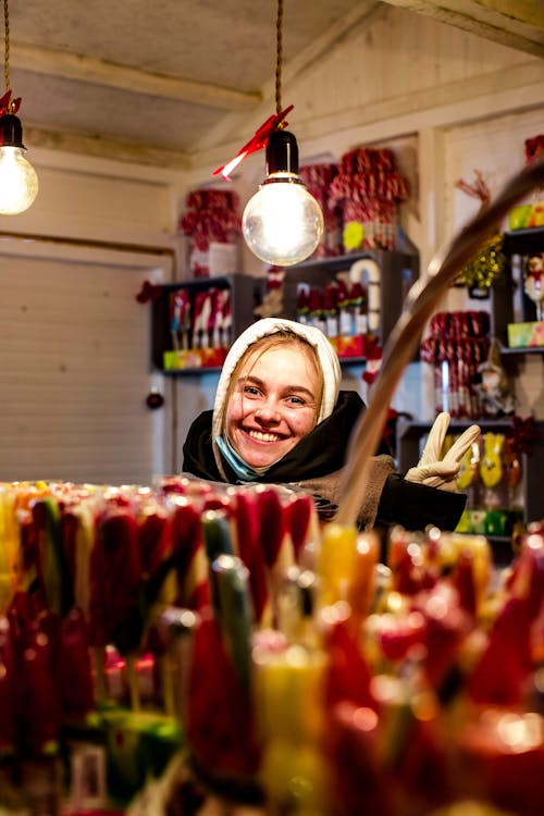 Young Happy Woman in a Candy Shop 